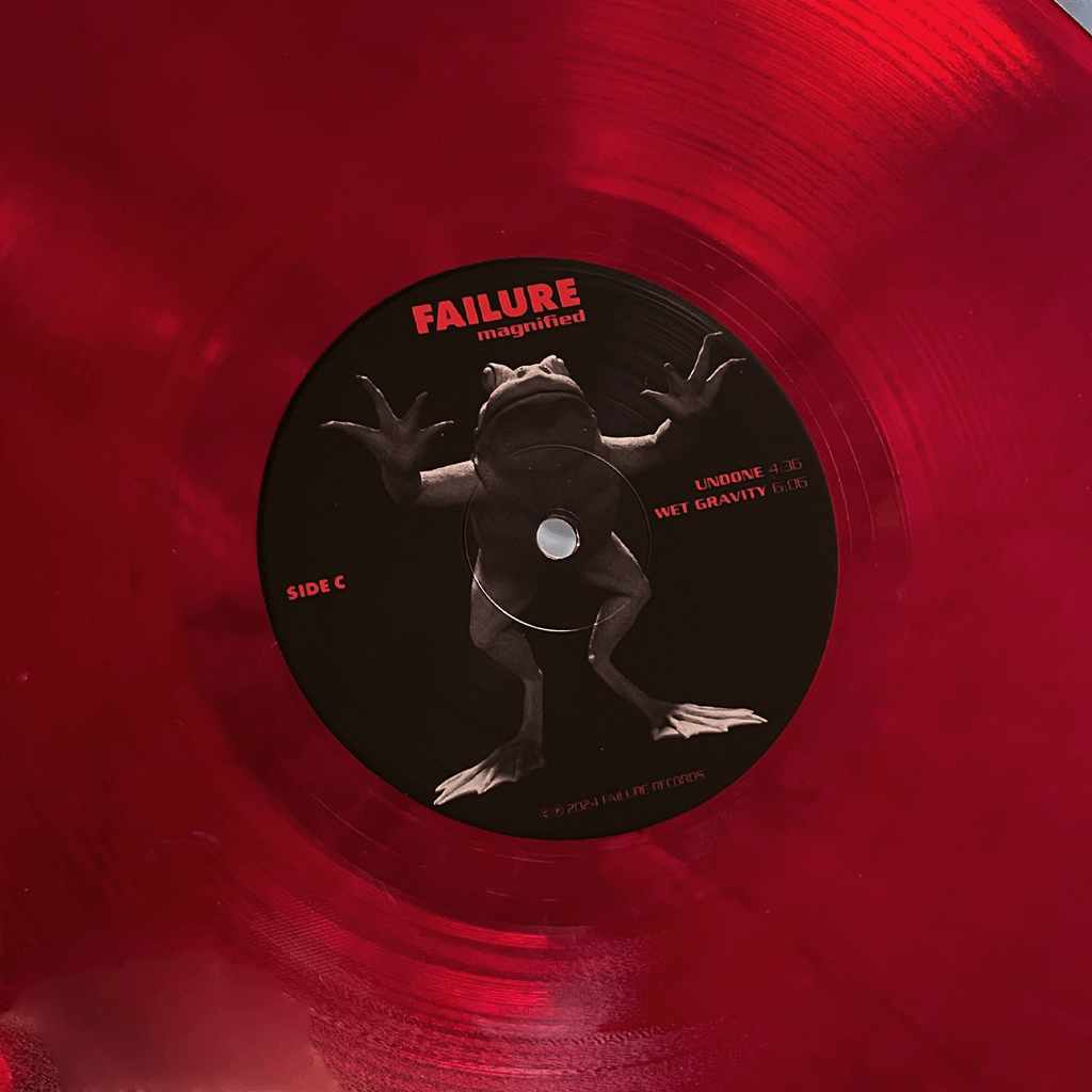 Magnified - 12" Clear Red Double Vinyl